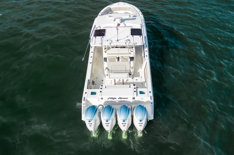  Yacht Photos Pics 2022 Pursuit S 428 Sport boat with four powerful engines on open water.