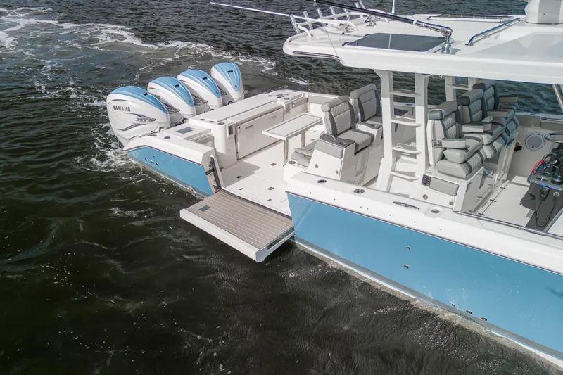  Yacht Photos Pics 2022 Pursuit S 428 Sport boat with Yamaha engines on water.