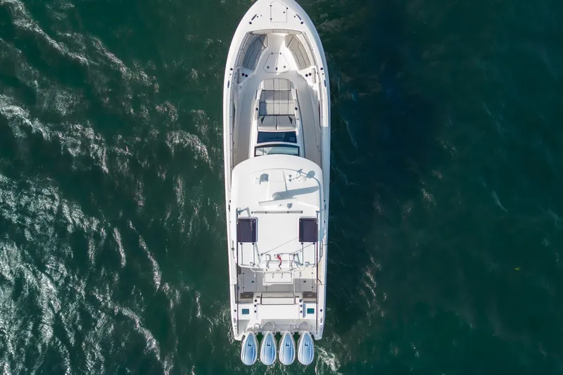  Yacht Photos Pics Aerial view of 2022 Pursuit S 428 Sport boat on open water.