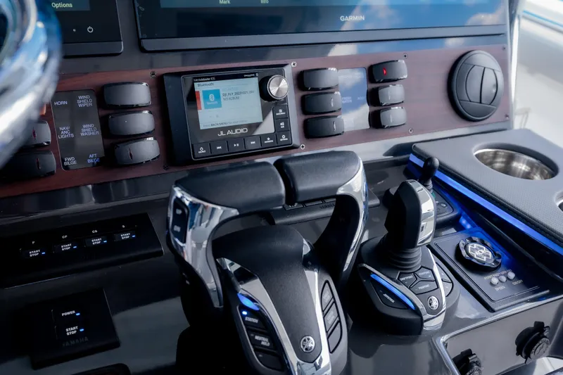  Yacht Photos Pics Control panel of 2022 Pursuit S 428 Sport boat with advanced navigation and audio systems.