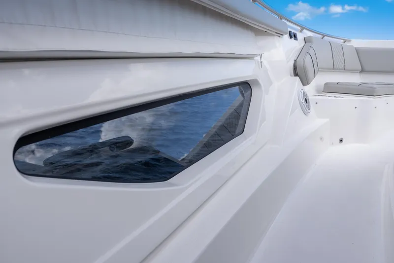  Yacht Photos Pics 2022 Pursuit S 428 Sport boat interior with sleek design and comfortable seating.