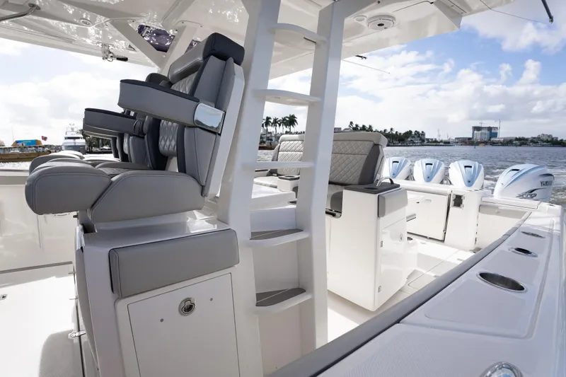  Yacht Photos Pics 2022 Pursuit S 428 Sport boat interior with luxurious seating and multiple Yamaha engines.