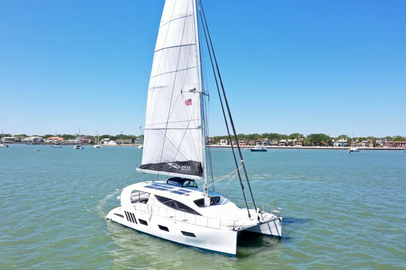 Fido Yacht Photos Pics 2017 Xquisite Yachts X5 sailing on calm waters under clear blue sky.