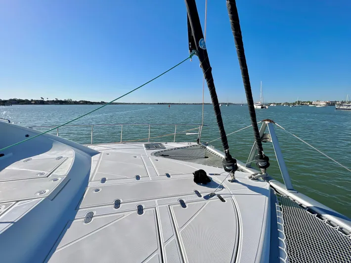 Fido Yacht Photos Pics 2017 Xquisite Yachts X5 catamaran deck with ocean view under clear blue sky.