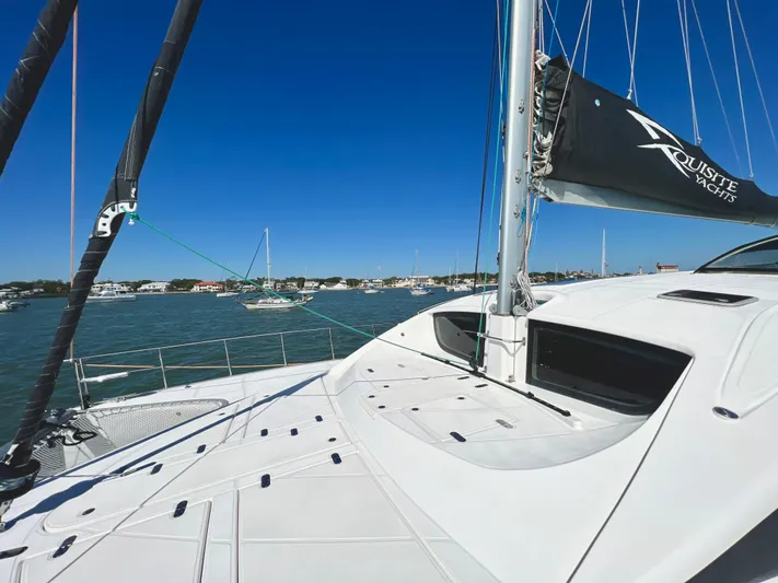 Fido Yacht Photos Pics 2017 Xquisite Yachts X5 sailing on calm waters under a clear blue sky.