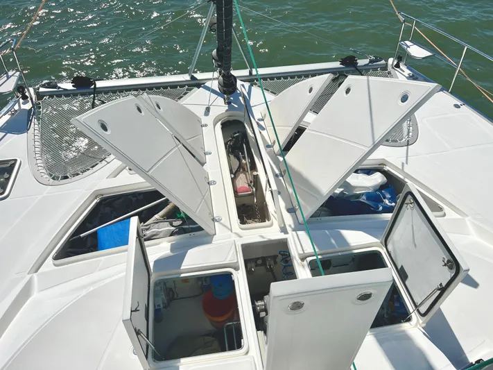 Fido Yacht Photos Pics Xquisite Yachts X5 2017 catamaran deck with open storage compartments on the water.