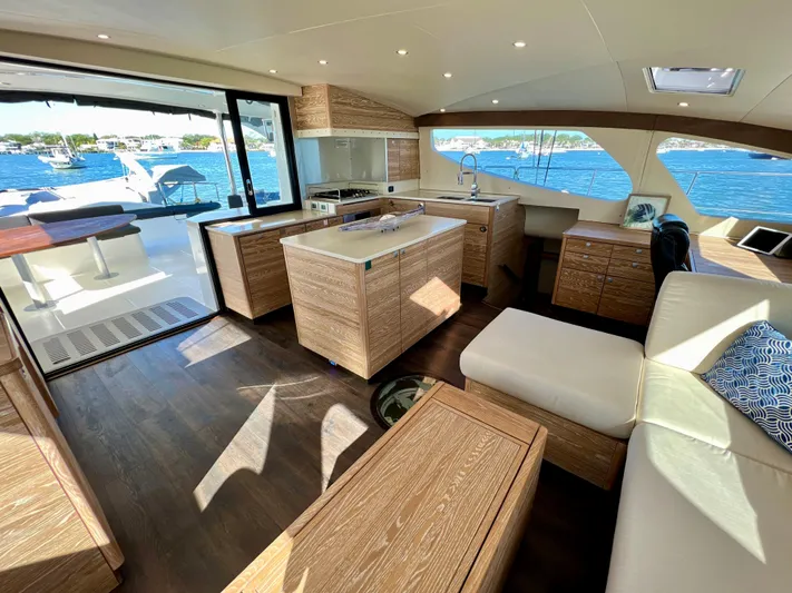 Fido Yacht Photos Pics Luxurious interior of 2017 Xquisite Yachts X5 with modern kitchen and scenic ocean view.
