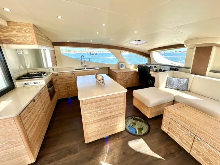 Fido Yacht Photos Pics Luxurious interior of 2017 Xquisite Yachts X5 with modern kitchen and seating area.