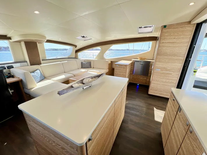 Fido Yacht Photos Pics Luxurious interior of 2017 Xquisite Yachts X5 with modern furnishings and panoramic windows.