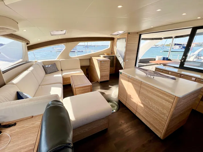 Fido Yacht Photos Pics Luxurious interior of 2017 Xquisite Yachts X5 with modern furnishings and panoramic windows.