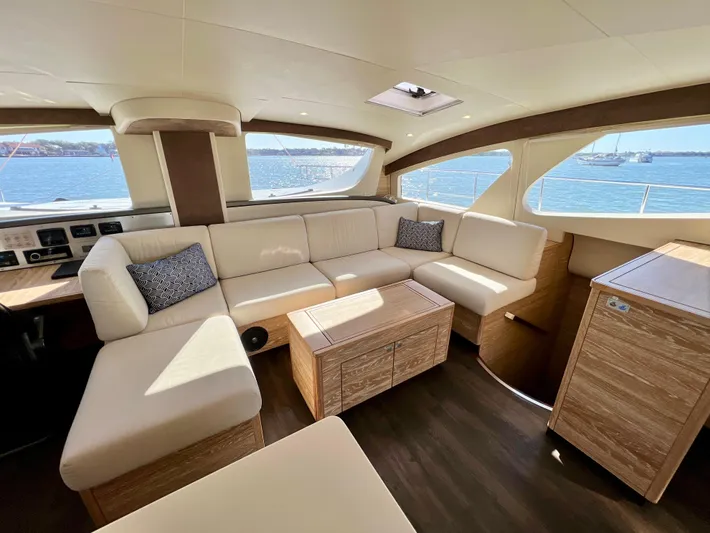 Fido Yacht Photos Pics Luxurious interior of 2017 Xquisite Yachts X5 with elegant seating and ocean view.