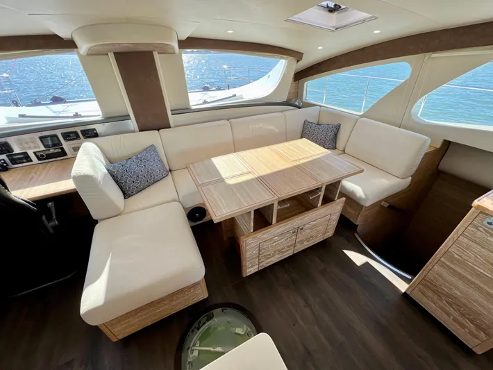 Fido Yacht Photos Pics Luxurious interior of 2017 Xquisite Yachts X5 with elegant seating and ocean view.
