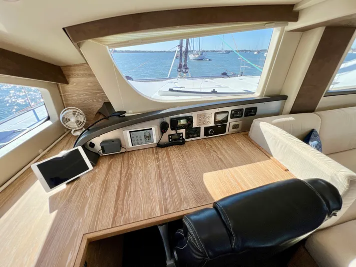 Fido Yacht Photos Pics Interior of 2017 Xquisite Yachts X5, featuring a navigation station with ocean view.