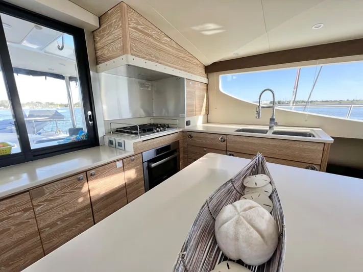 Fido Yacht Photos Pics Modern kitchen interior of 2017 Xquisite Yachts X5 with ocean view.