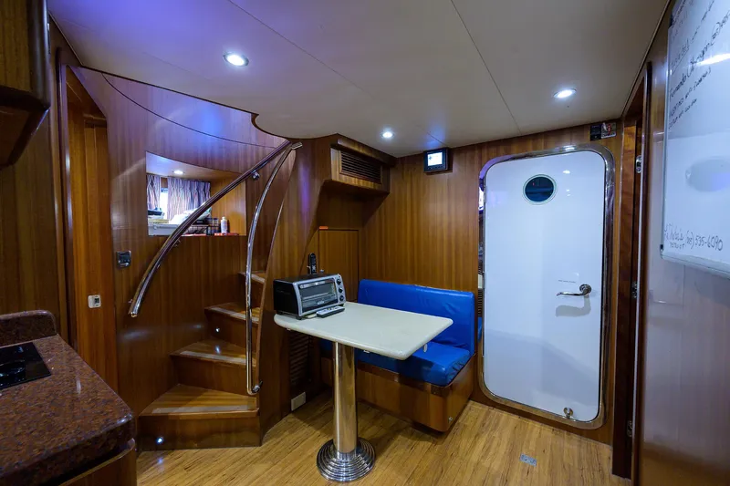 Barnstar Yacht Photos Pics Ocean Alexander 80 BARNSTAR - Crew Lounge Table & Access