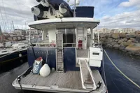 2008 Beneteau Swift Trawler 52 docked at marina, rear view with equipment.