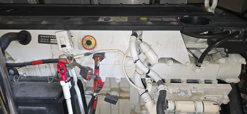 Live Now Yacht Photos Pics Engine compartment of a 2006 Carver 44CPMY yacht, featuring wiring and components.