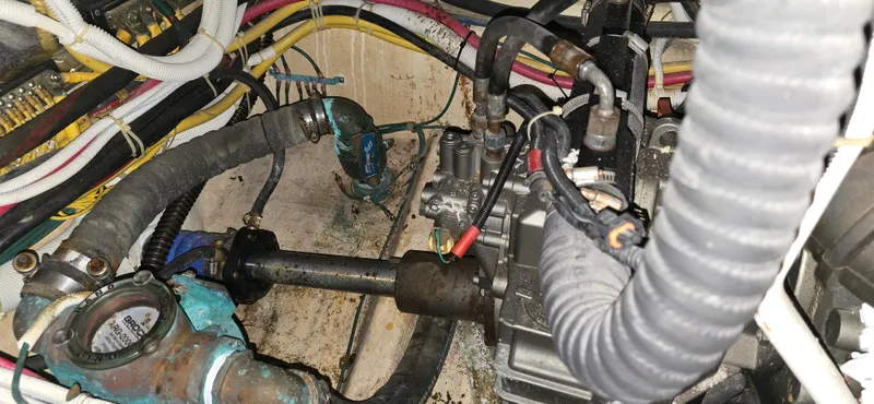 Live Now Yacht Photos Pics Engine compartment of a 2006 Carver 44CPMY with visible wiring and hoses.