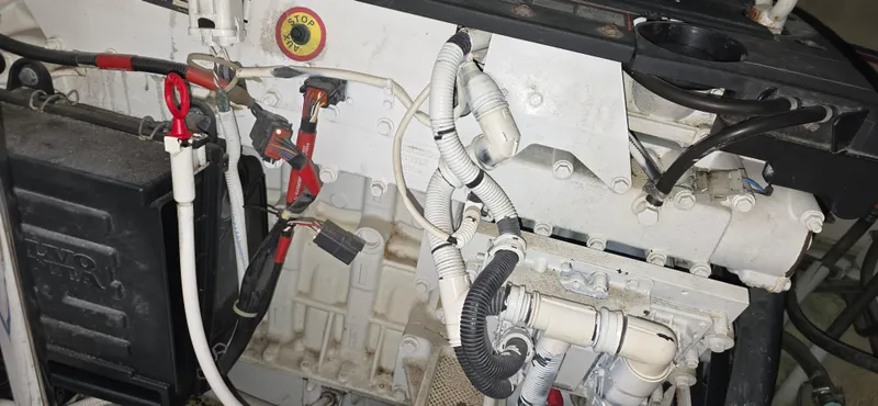Live Now Yacht Photos Pics Engine compartment of a 2006 Carver 44CPMY yacht, showing wiring and components.