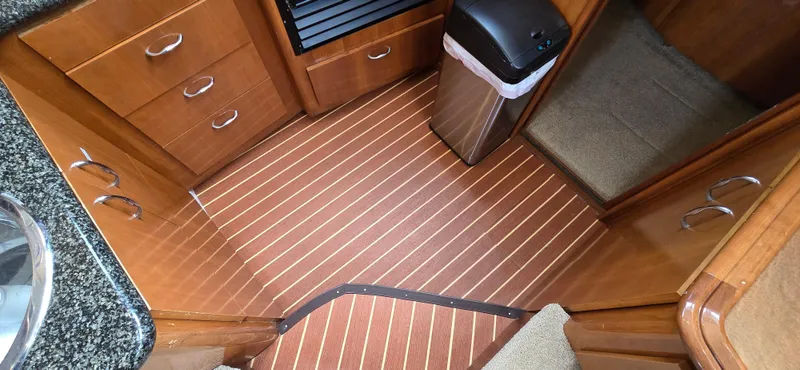 Live Now Yacht Photos Pics Interior of 2006 Carver 44CPMY yacht with wood flooring and cabinetry.