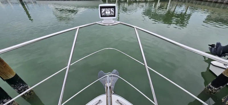 Live Now Yacht Photos Pics Bow view of 2006 Carver 44CPMY yacht in calm marina waters.