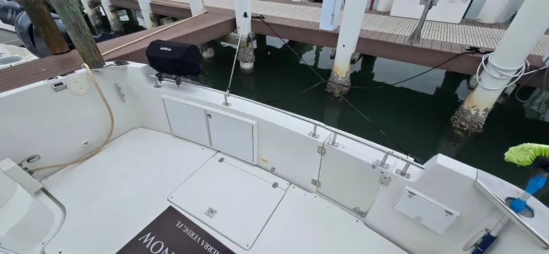 Live Now Yacht Photos Pics 2006 Carver 44CPMY yacht docked, showing spacious deck and clean white finish.