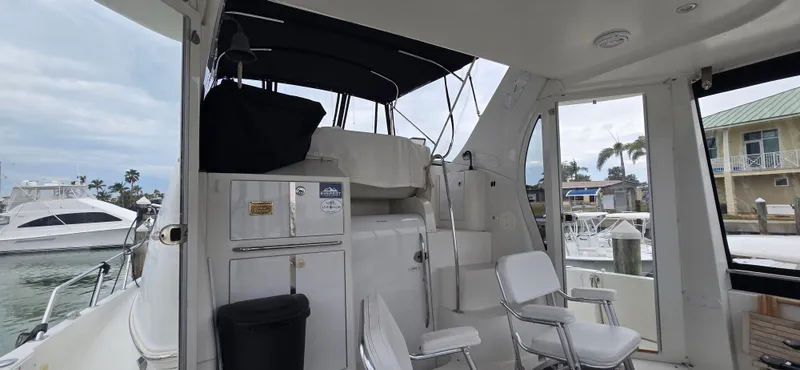 Live Now Yacht Photos Pics Interior view of 2006 Carver 44CPMY yacht with seating and storage.