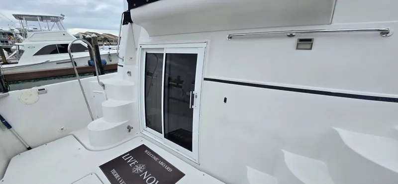 Live Now Yacht Photos Pics 2006 Carver 44CPMY yacht with white exterior, docked, featuring a sliding door and steps.