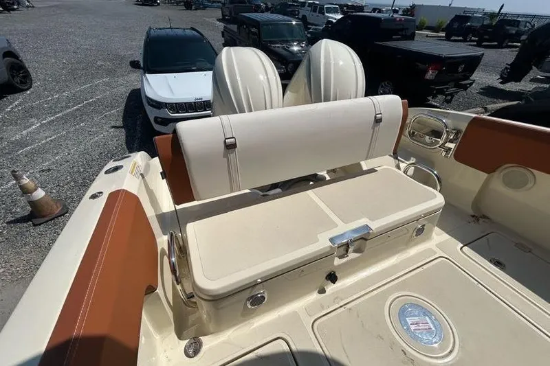  Yacht Photos Pics 2024 Capoforte FX270 boat interior with seating and storage compartments.