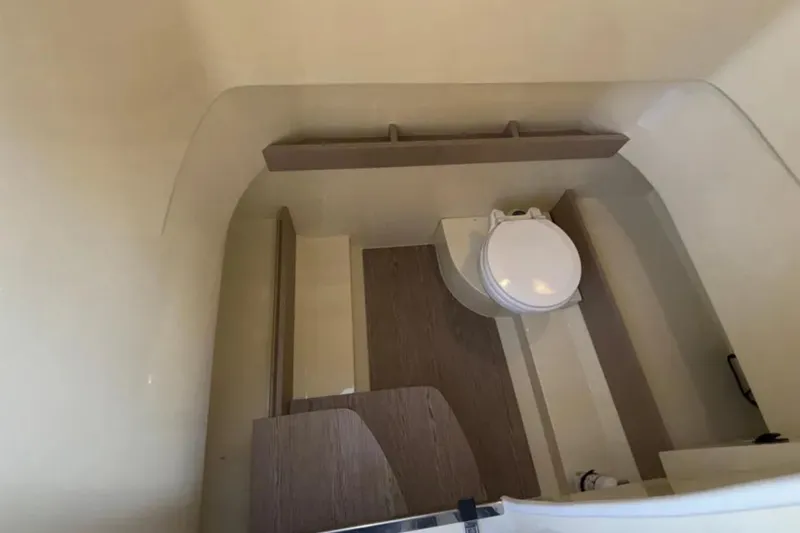  Yacht Photos Pics 2024 Capoforte FX270 boat interior bathroom with modern fixtures and wooden accents.