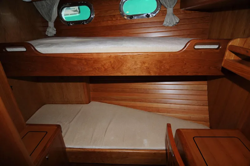  Yacht Photos Pics Cozy wooden bunk beds in 2026 Selene 54 yacht cabin.