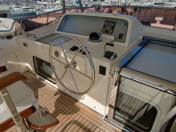 Yacht Photos Pics Helm of 2026 Selene 54 yacht with steering wheel and navigation controls.