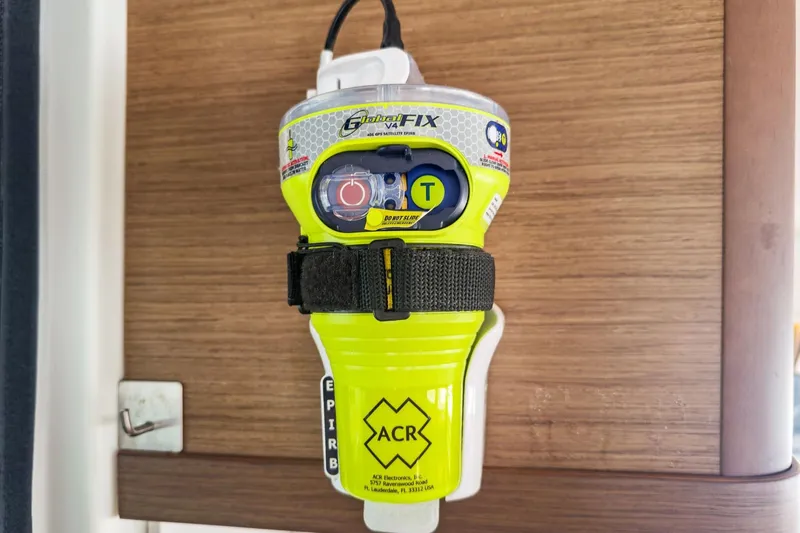 Sweet Sweet Life Yacht Photos Pics Emergency beacon on Lagoon 42 yacht, 2020 model, mounted on wooden panel.