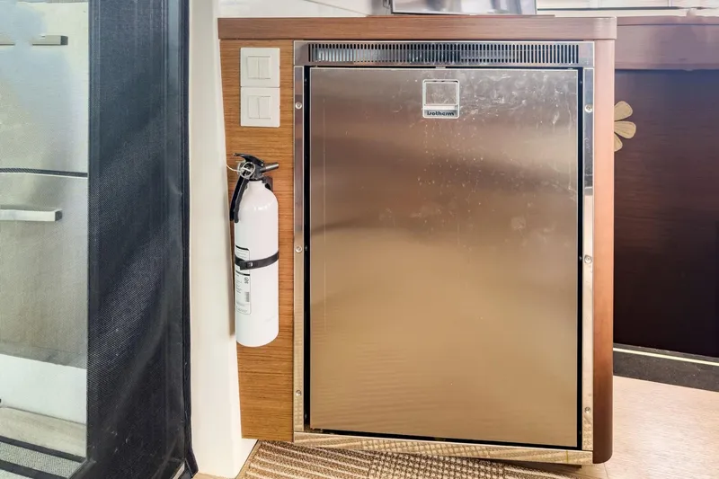Sweet Sweet Life Yacht Photos Pics Stainless steel fridge and fire extinguisher in 2020 Lagoon 42 yacht interior.