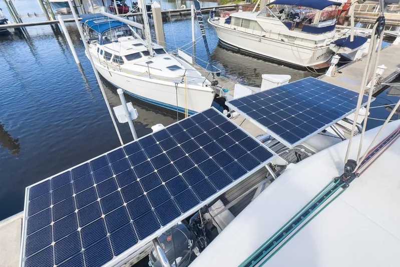 Sweet Sweet Life Yacht Photos Pics 2020 Lagoon 42 catamaran with solar panels docked at marina.