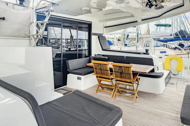 Sweet Sweet Life Yacht Photos Pics Spacious deck of 2020 Lagoon 42 catamaran with seating and dining area.