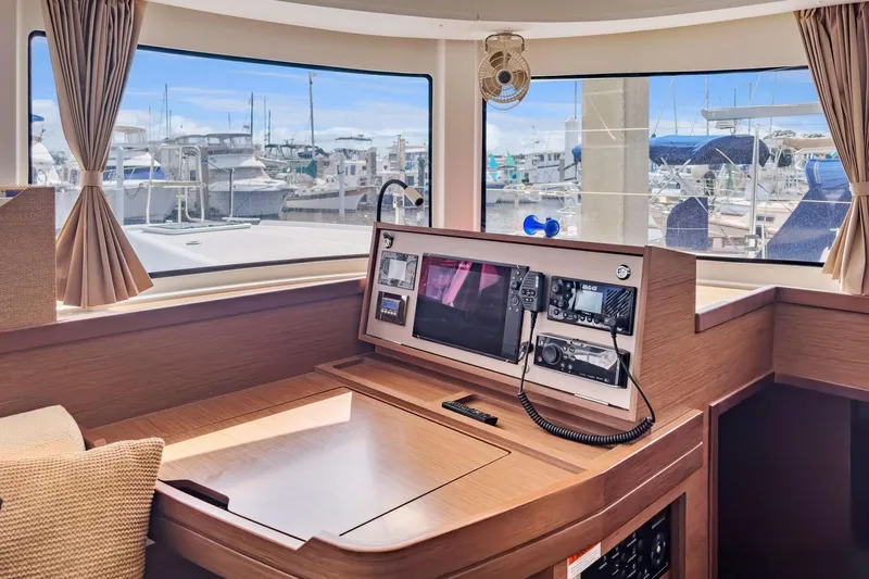 Sweet Sweet Life Yacht Photos Pics Interior of 2020 Lagoon 42 yacht with navigation equipment and marina view.