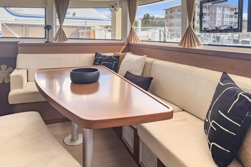 Sweet Sweet Life Yacht Photos Pics Interior of 2020 Lagoon 42 catamaran with elegant dining area and plush seating.