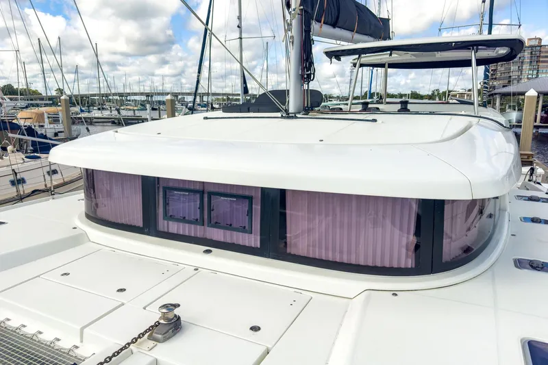 Sweet Sweet Life Yacht Photos Pics 2020 Lagoon 42 catamaran docked at marina, showcasing sleek design and modern features.