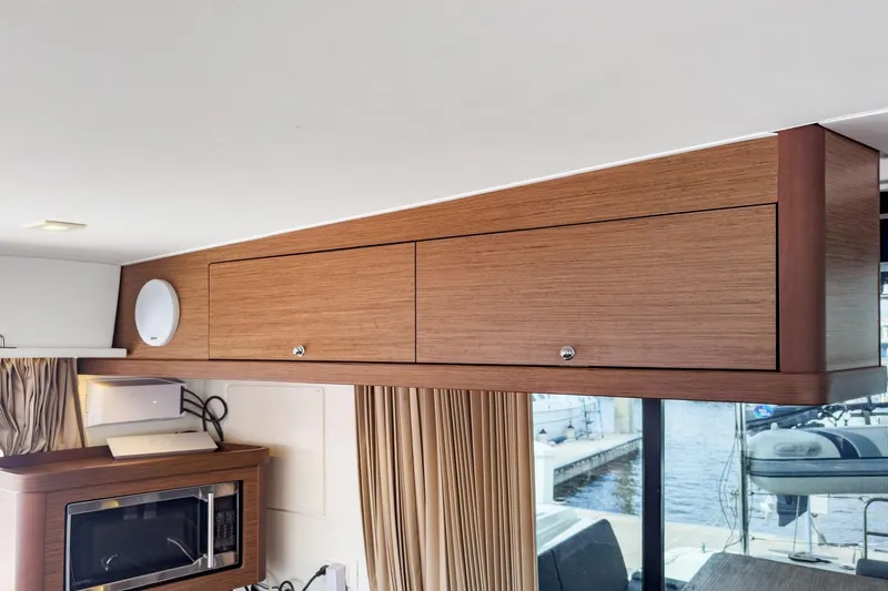 Sweet Sweet Life Yacht Photos Pics Interior of 2020 Lagoon 42 yacht with wooden cabinets and modern appliances.