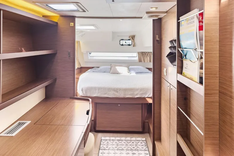 Sweet Sweet Life Yacht Photos Pics Luxurious interior of 2020 Lagoon 42 yacht with cozy bedroom and wooden furnishings.