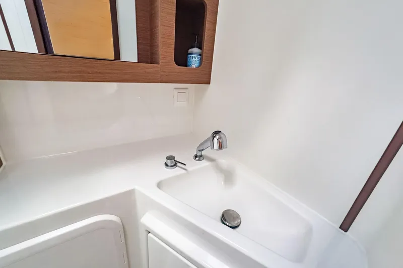 Sweet Sweet Life Yacht Photos Pics Modern bathroom sink in 2020 Lagoon 42 yacht, featuring sleek design and wooden accents.