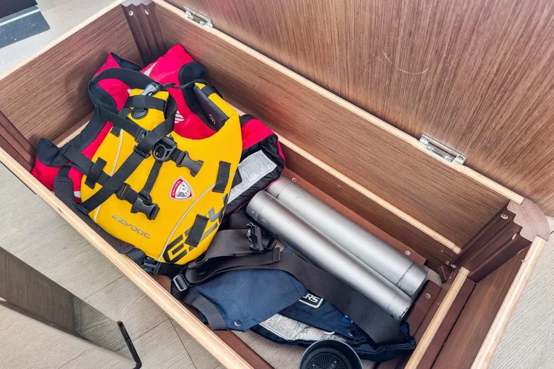 Sweet Sweet Life Yacht Photos Pics Storage compartment on a 2020 Lagoon 42 yacht with life jackets and equipment.
