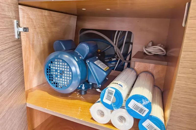 Sweet Sweet Life Yacht Photos Pics Storage compartment with blue motor and filters in 2020 Lagoon 42 yacht.