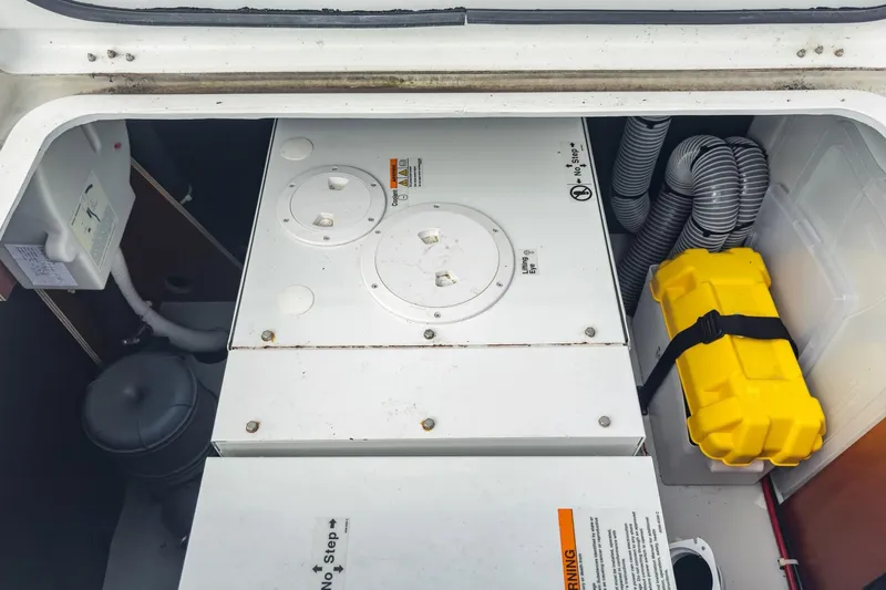 Sweet Sweet Life Yacht Photos Pics Engine compartment of a 2020 Lagoon 42 catamaran with equipment and safety gear.