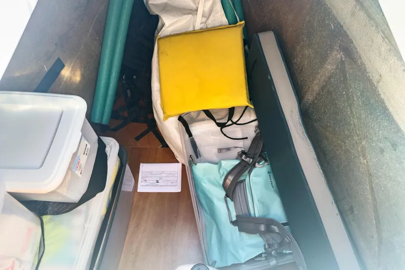 Sweet Sweet Life Yacht Photos Pics Storage compartment of a 2020 Lagoon 42 yacht with various items and equipment.