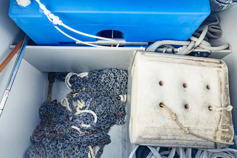 Sweet Sweet Life Yacht Photos Pics Storage compartment of 2020 Lagoon 42 with ropes, chains, and blue tank.