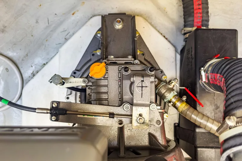 Sweet Sweet Life Yacht Photos Pics Engine compartment of a 2020 Lagoon 42 catamaran, showcasing mechanical components and hoses.