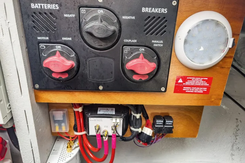 Sweet Sweet Life Yacht Photos Pics Battery and breaker panel on a 2020 Lagoon 42 yacht, featuring switches and wiring.