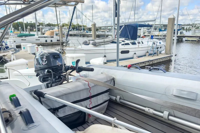 Sweet Sweet Life Yacht Photos Pics Inflatable boat with motor at marina, near Lagoon 42 catamaran, 2020 model.